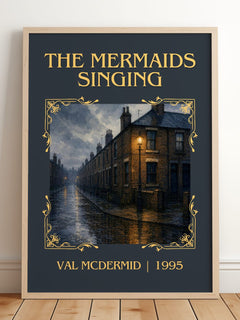 The Mermaids Singing Classic Book Art Print by Val McDermid – framed print leaning on a wooden floor