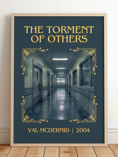 The Torment of Others Classic Book Art Print by Val McDermid – framed print leaning on a wooden floor