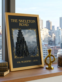 The Skeleton Road Classic Book Art Print by Val McDermid – framed print on a city-view windowsill
