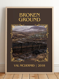 Broken Ground Classic Book Art Print by Val McDermid – framed print leaning on a wooden floor