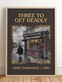 Three to Get Deadly Classic Book Art Print by Janet Evanovich – framed print leaning on a wooden floor