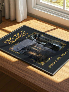 Explosive Eighteen Classic Book Art Print by Janet Evanovich – print on a sunlit desk
