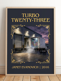 Turbo Twenty-Three Classic Book Art Print by Janet Evanovich – framed print leaning on a wooden floor
