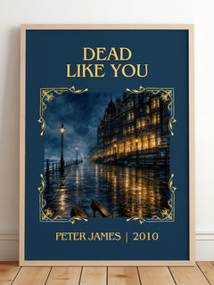 Dead Like You Classic Book Art Print by Peter James – framed print leaning on a wooden floor