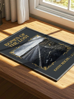 Bones of the Lost Classic Book Art Print by Kathy Reichs – print on a sunlit desk