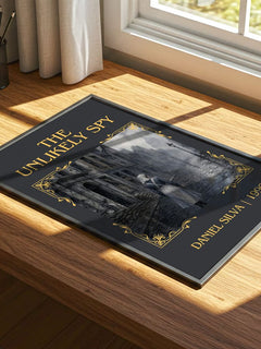 The Unlikely Spy Classic Book Art Print by Daniel Silva – print on a sunlit desk