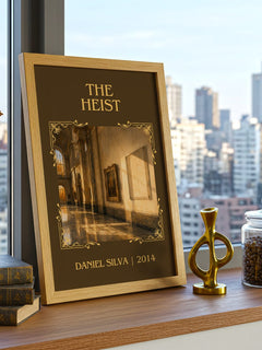 The Heist Classic Book Art Print by Daniel Silva – framed print on a city-view windowsill