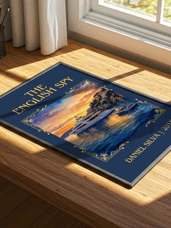 The English Spy Classic Book Art Print by Daniel Silva – print on a sunlit desk