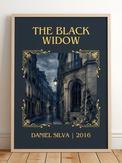 The Black Widow Classic Book Art Print by Daniel Silva – framed print leaning on a wooden floor