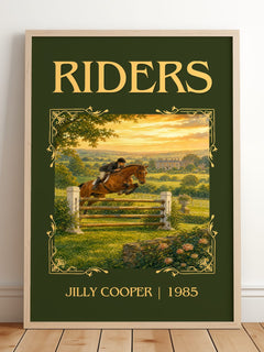 Riders Classic Book Art Print by Jilly Cooper – framed print leaning on a wooden floor