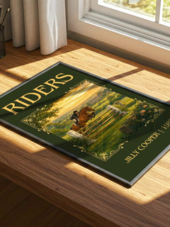 Riders Classic Book Art Print by Jilly Cooper – print on a sunlit desk
