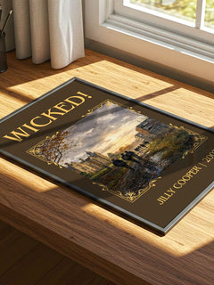 Wicked! Classic Book Art Print by Jilly Cooper – print on a sunlit desk