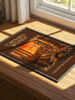 Caesar's Women Classic Book Art Print by Colleen McCullough – print on a sunlit desk