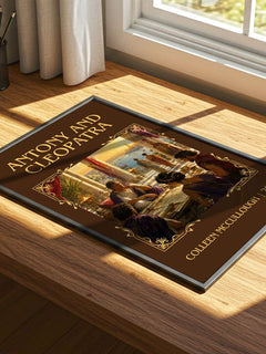 Antony and Cleopatra Classic Book Art Print by Colleen McCullough – print on a sunlit desk