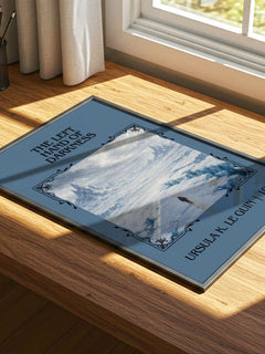 The Left Hand of Darkness Classic Book Art Print by Ursula K. Le Guin – print on a sunlit desk