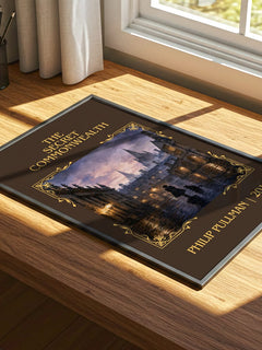 The Secret Commonwealth Classic Book Art Print by Philip Pullman – print on a sunlit desk
