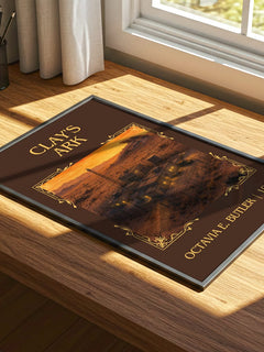 Clay's Ark Classic Book Art Print by Octavia E. Butler – print on a sunlit desk