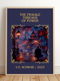 The Fragile Threads of Power Classic Book Art Print by V.E. Schwab – framed print leaning on a wooden floor