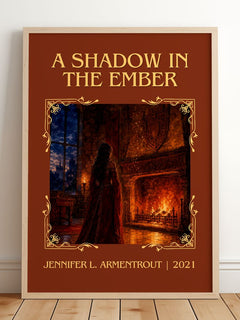 A Shadow in the Ember Classic Book Art Print by Jennifer L. Armentrout – framed print leaning on a wooden floor