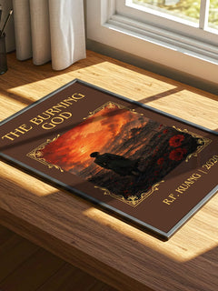 The Burning God Classic Book Art Print by R.F. Kuang – print on a sunlit desk