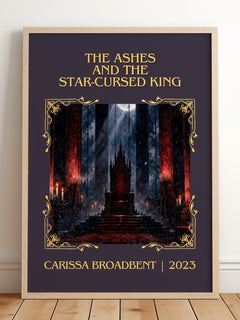 Ashes and the Star-Cursed King Classic Book Art Print by C. Broadbent – framed print leaning on a wooden floor