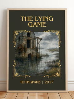 The Lying Game Classic Book Art Print by Ruth Ware – framed print leaning on a wooden floor