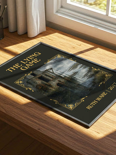 The Lying Game Classic Book Art Print by Ruth Ware – print on a sunlit desk