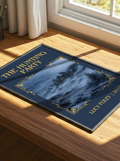 The Hunting Party Classic Book Art Print by Lucy Foley – print on a sunlit desk