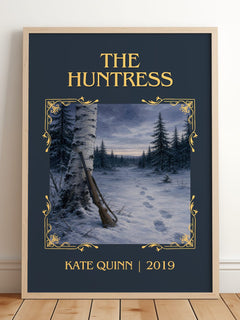 The Huntress Classic Book Art Print by Kate Quinn – framed print leaning on a wooden floor