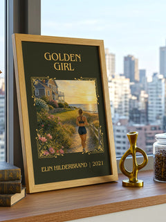 Golden Girl Classic Book Art Print by Elin Hilderbrand – framed print on a city-view windowsill