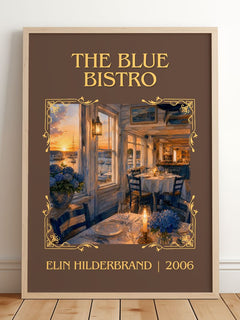 The Blue Bistro Classic Book Art Print by Elin Hilderbrand – framed print leaning on a wooden floor