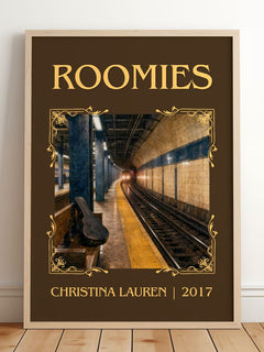Roomies Classic Book Art Print by Christina Lauren – framed print leaning on a wooden floor