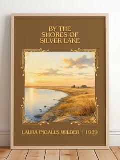 By the Shores of Silver Lake Classic Book Art Print by L. Wilder – framed print leaning on a wooden floor