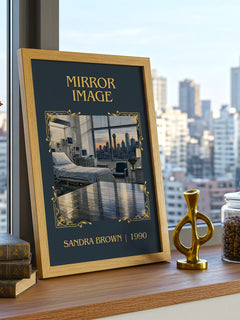 Mirror Image Classic Book Art Print by Sandra Brown – framed print on a city-view windowsill