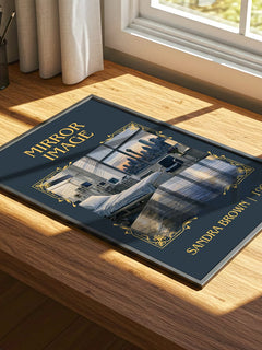Mirror Image Classic Book Art Print by Sandra Brown – print on a sunlit desk