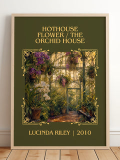 Hothouse Flower / The Orchid House Classic Book Art Print by L. Riley – framed print leaning on a wooden floor