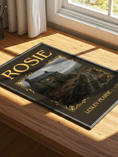 Rosie Classic Book Art Print by Lesley Pearse – print on a sunlit desk