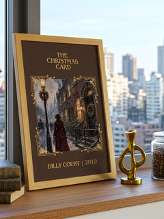 The Christmas Card Classic Book Art Print by Dilly Court – framed print on a city-view windowsill