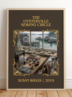 The Oysterville Sewing Circle Classic Book Art Print by Susan Wiggs – framed print leaning on a wooden floor