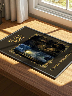 Black Alibi Classic Book Art Print by Cornell Woolrich – print on a sunlit desk