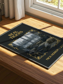 Real Tigers Classic Book Art Print by Mick Herron – print on a sunlit desk