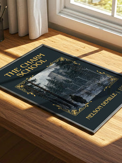 The Charm School Classic Book Art Print by Nelson DeMille – print on a sunlit desk