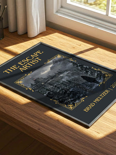 The Escape Artist Classic Book Art Print by Brad Meltzer – print on a sunlit desk