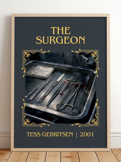 The Surgeon Classic Book Art Print by Tess Gerritsen – framed print leaning on a wooden floor