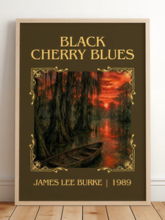 Black Cherry Blues Classic Book Art Print by James Lee Burke – framed print leaning on a wooden floor