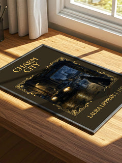 Charm City Classic Book Art Print by Laura Lippman – print on a sunlit desk