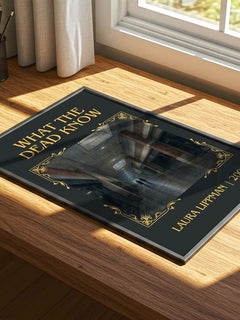 What the Dead Know Classic Book Art Print by Laura Lippman – print on a sunlit desk