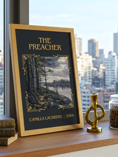 The Preacher Classic Book Art Print by Camilla Läckberg – framed print on a city-view windowsill