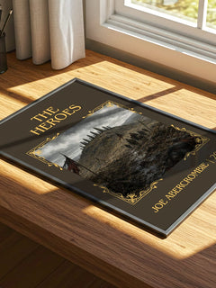 The Heroes Classic Book Art Print by Joe Abercrombie – print on a sunlit desk