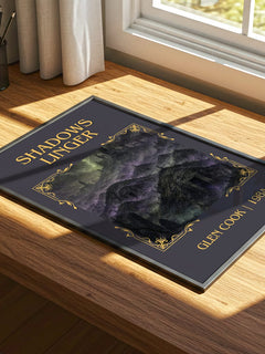 Shadows Linger Classic Book Art Print by Glen Cook – print on a sunlit desk